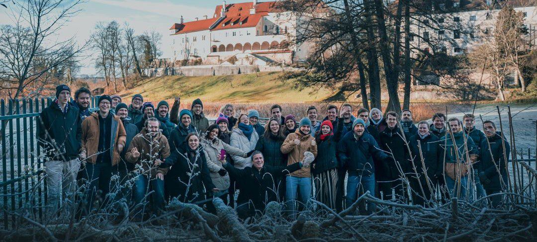 The EOMAP team gathered in front of Seefeld Castle, its headquarters
